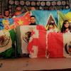 This is an image of students holding their country flags.