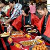 International students cook and serve their country favorite dishes. 