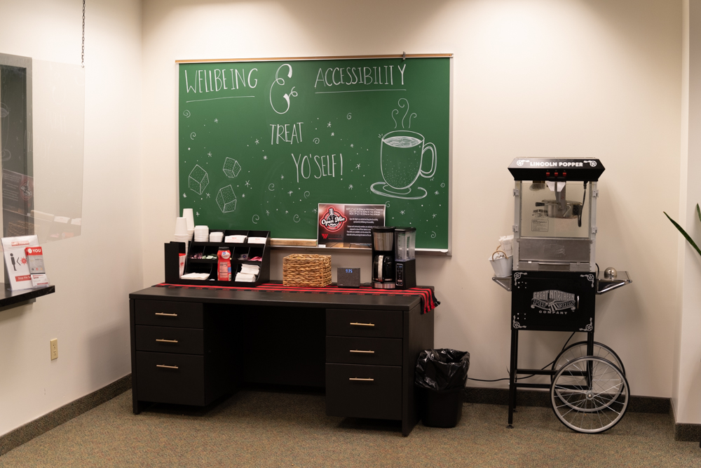 Treat Yo'self Chalk Board that reads "Wellbeing & Accessibility Treat Yo'self"