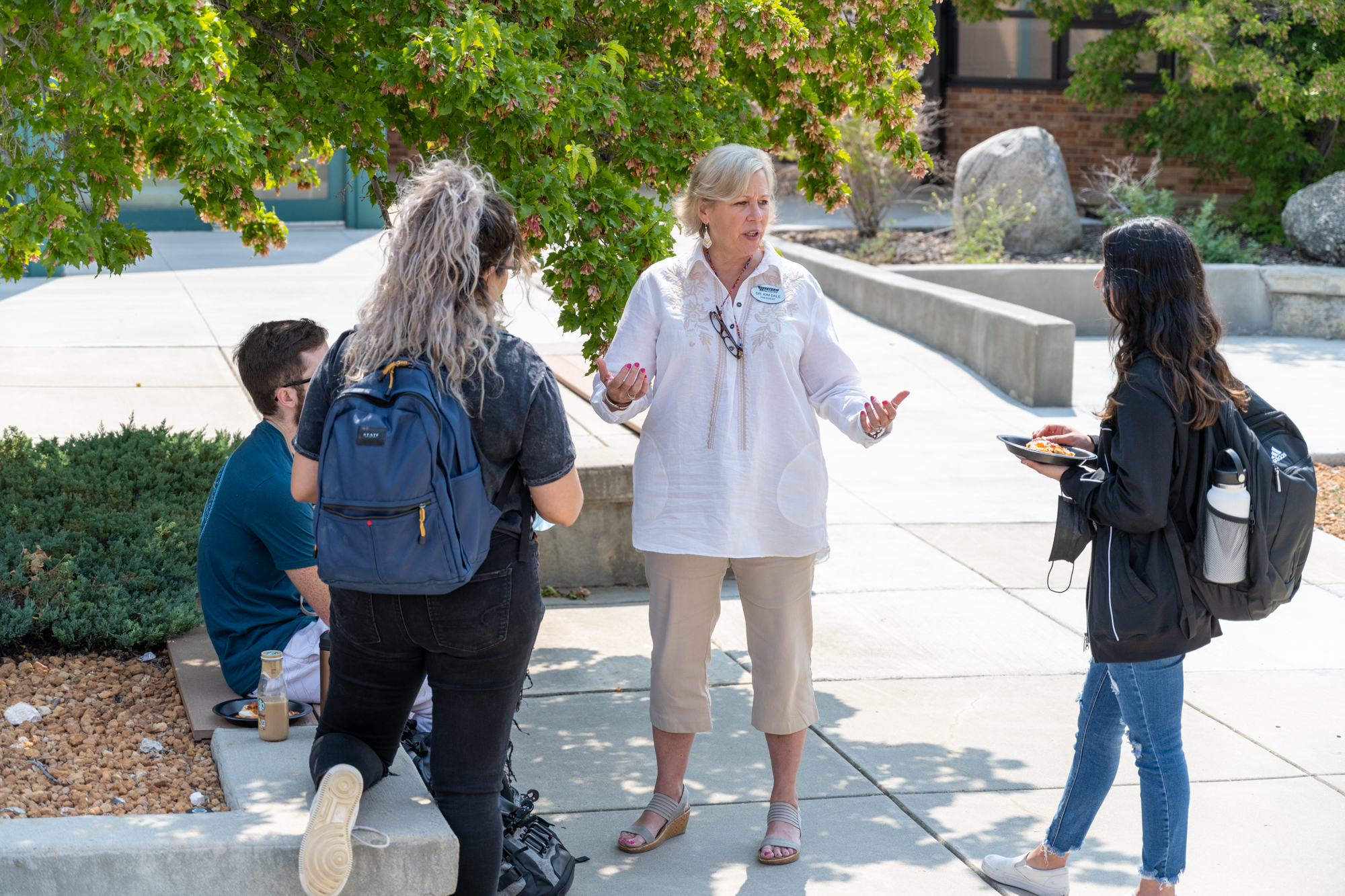 President Dr. Dale talking with students 