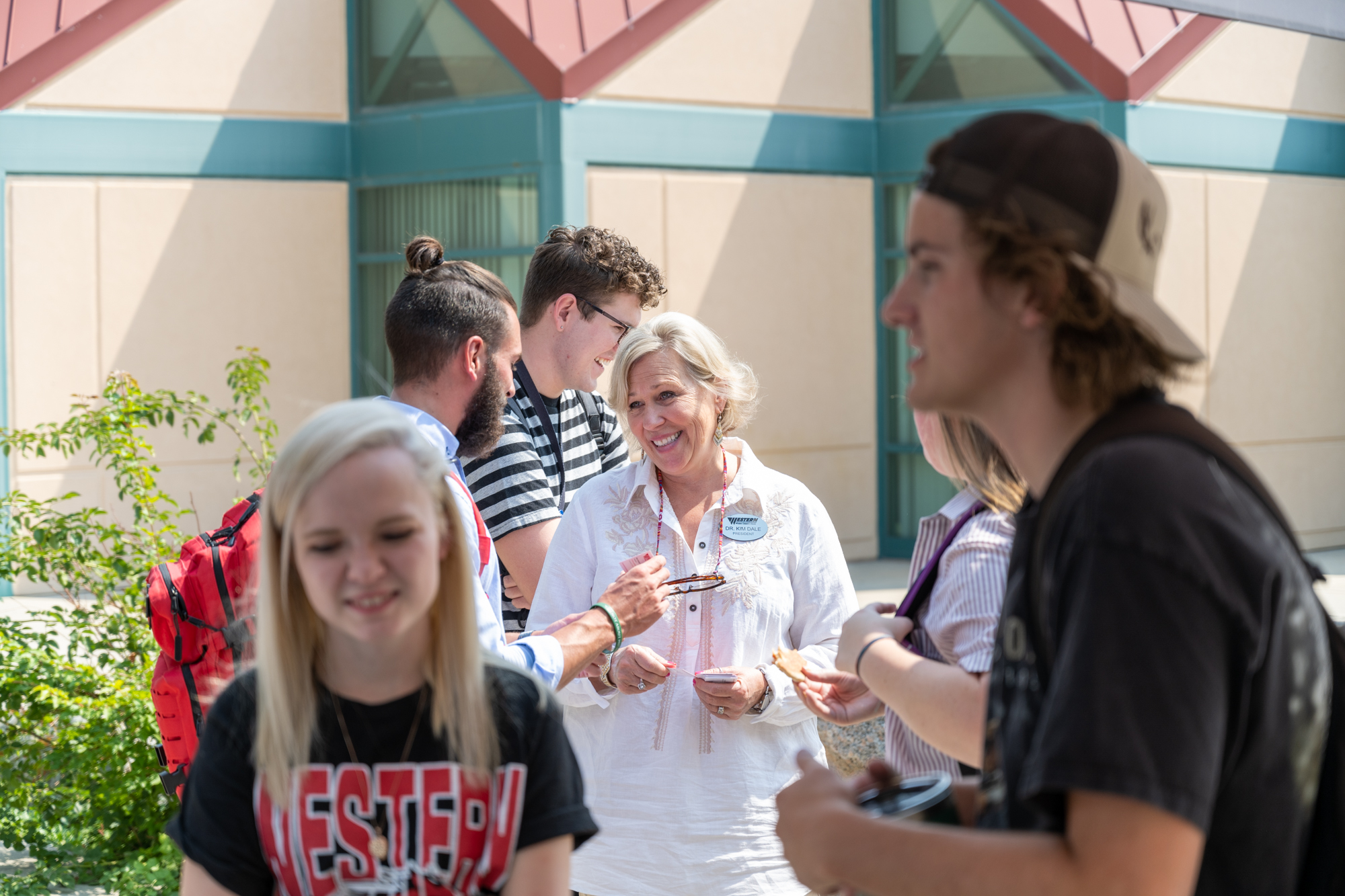 President Dr. Dale talking to students 