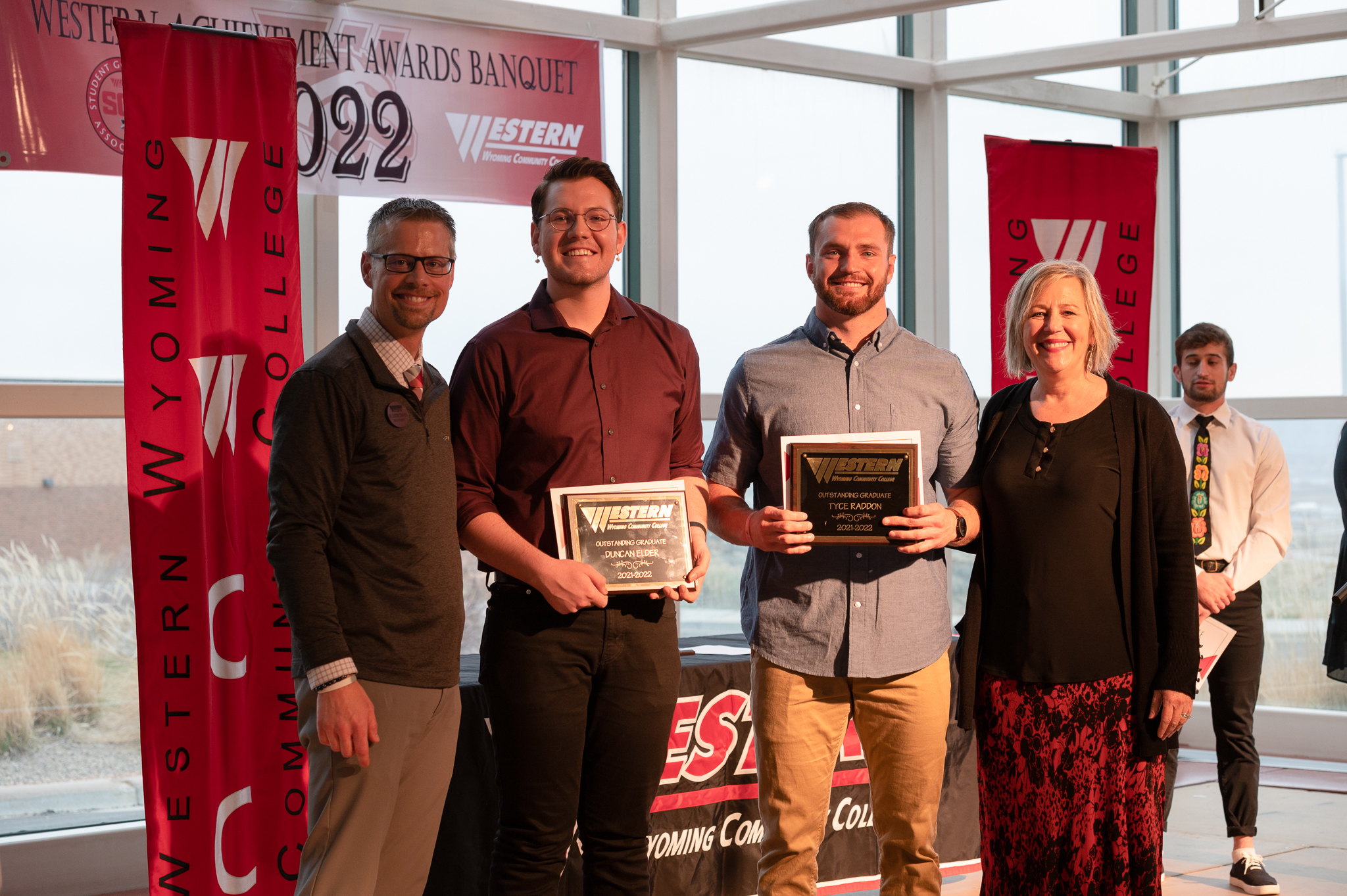 President Dr. Dale and Dr. Dustin Conover posed with western's outstanding graduates