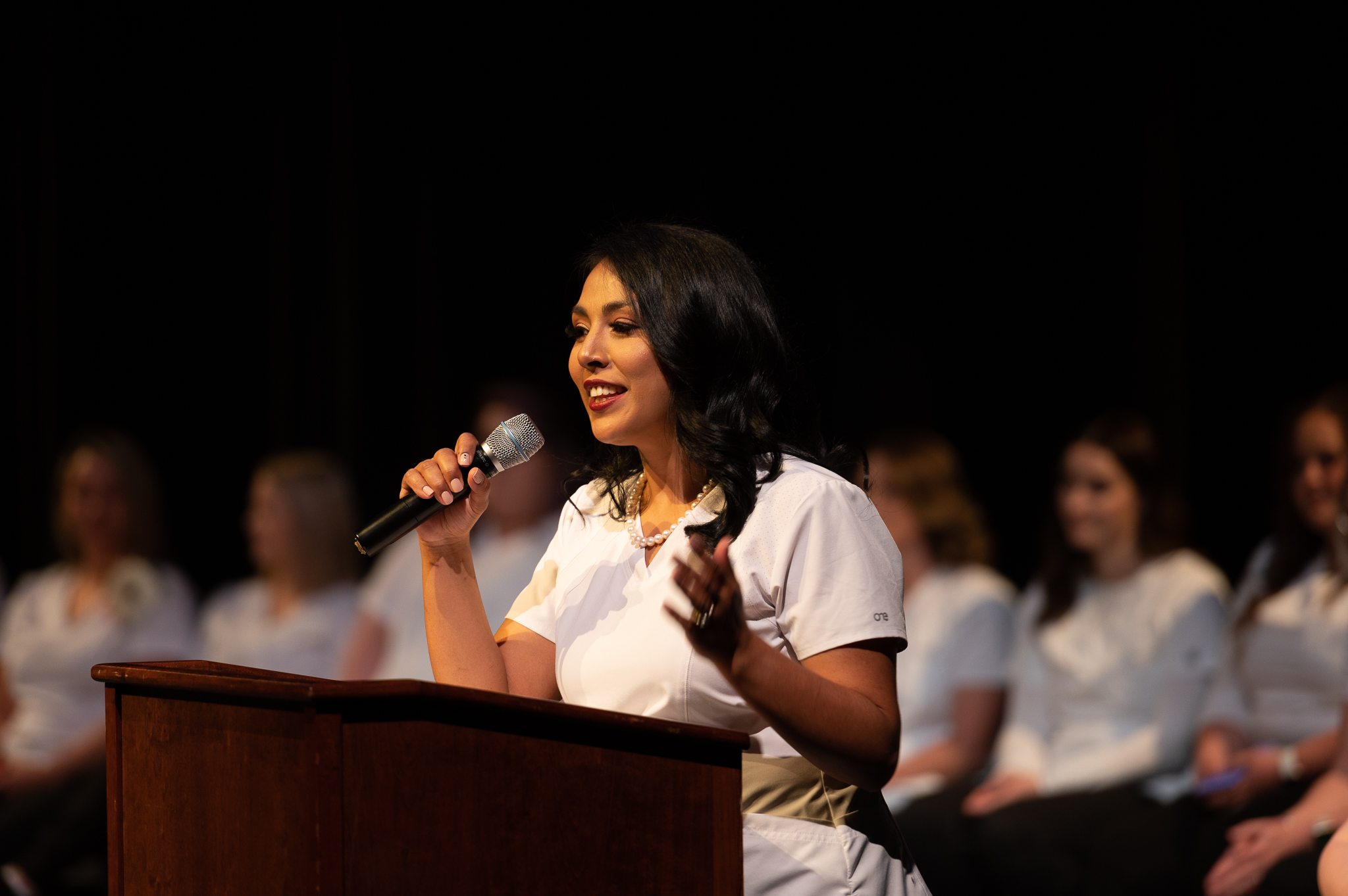 Nursing graduate giving speech from the stage