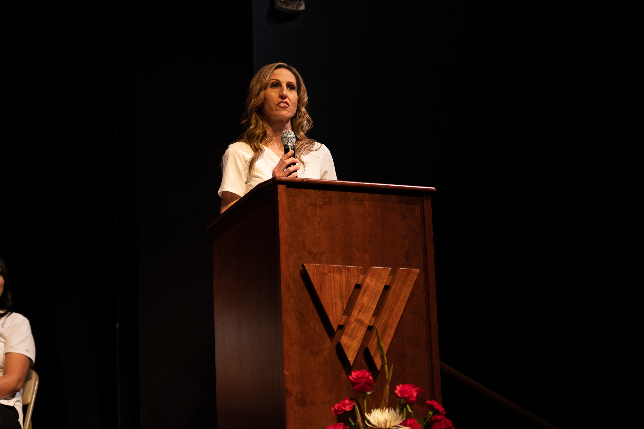 Nursing graduate giving speech from the stage