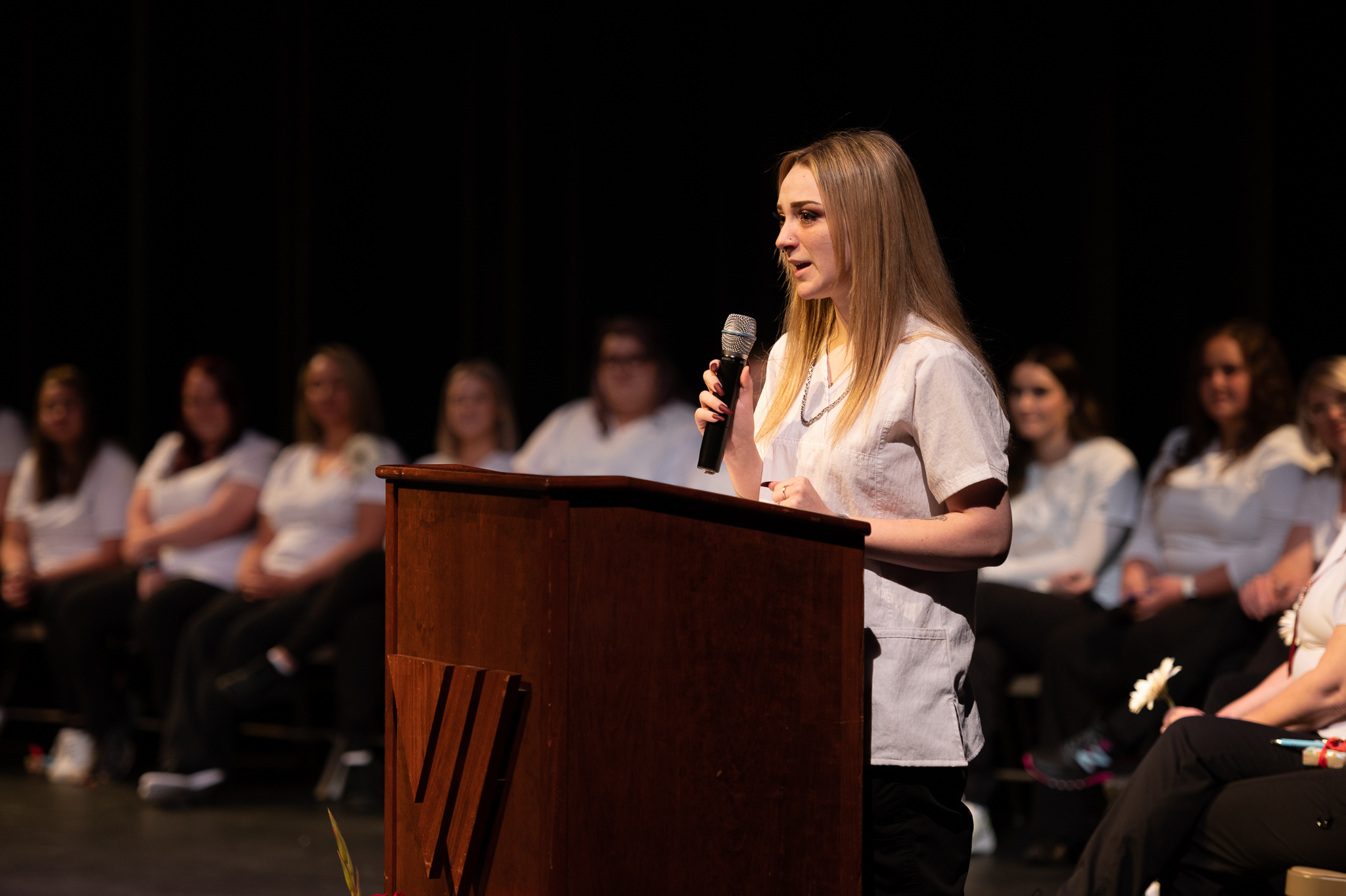 Nursing Graduate Class of 22 Nursing graduate giving speech from the stage
