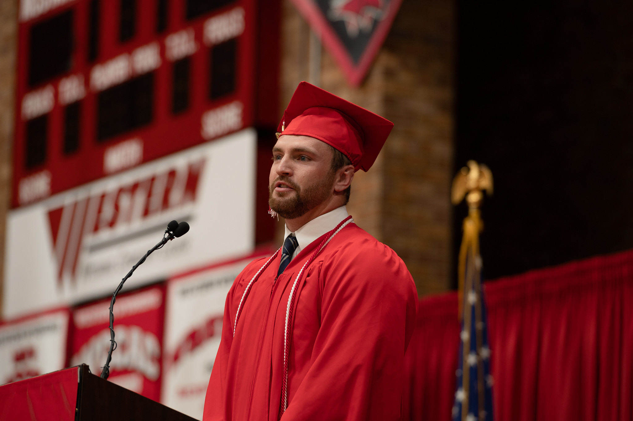 Outstanding graduate giving speech from the stage 