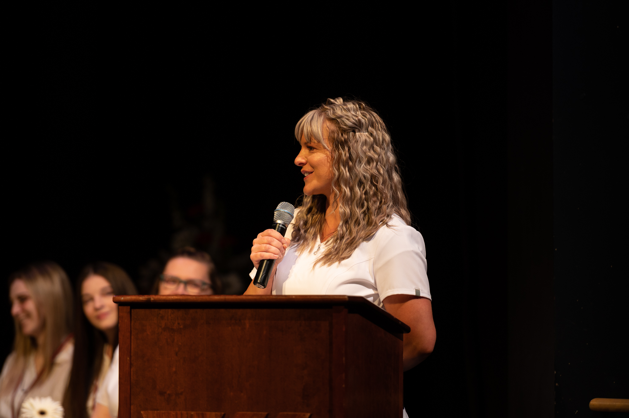 Nursing graduate giving speech from the stage