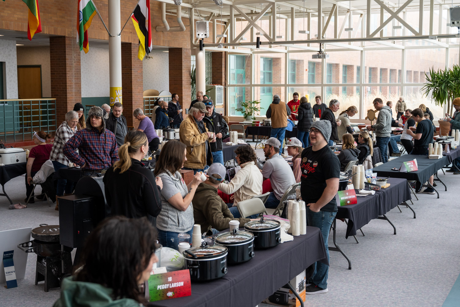 Various Chili Stations with Crowds Forming