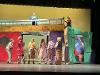 Actors on stage performing for the "Urinetown" production