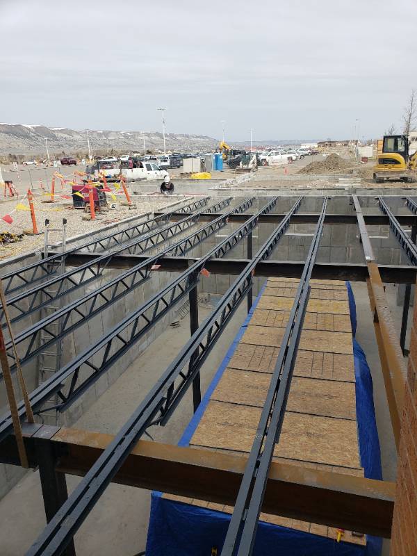 The new air handler unit is in the basement with the steel structure for the main floor.  
