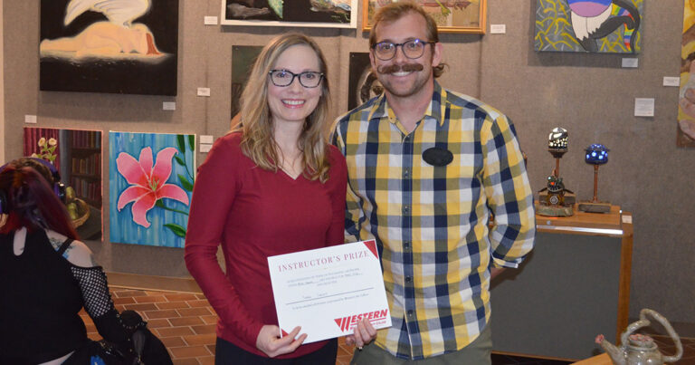 Sara Croft stands with Western Wyoming College Assistant Professor of Art Ben Nathan after being selected by Instructor of Ceramics and 3D Design Bart Fetz for his Instructor’s Prize.