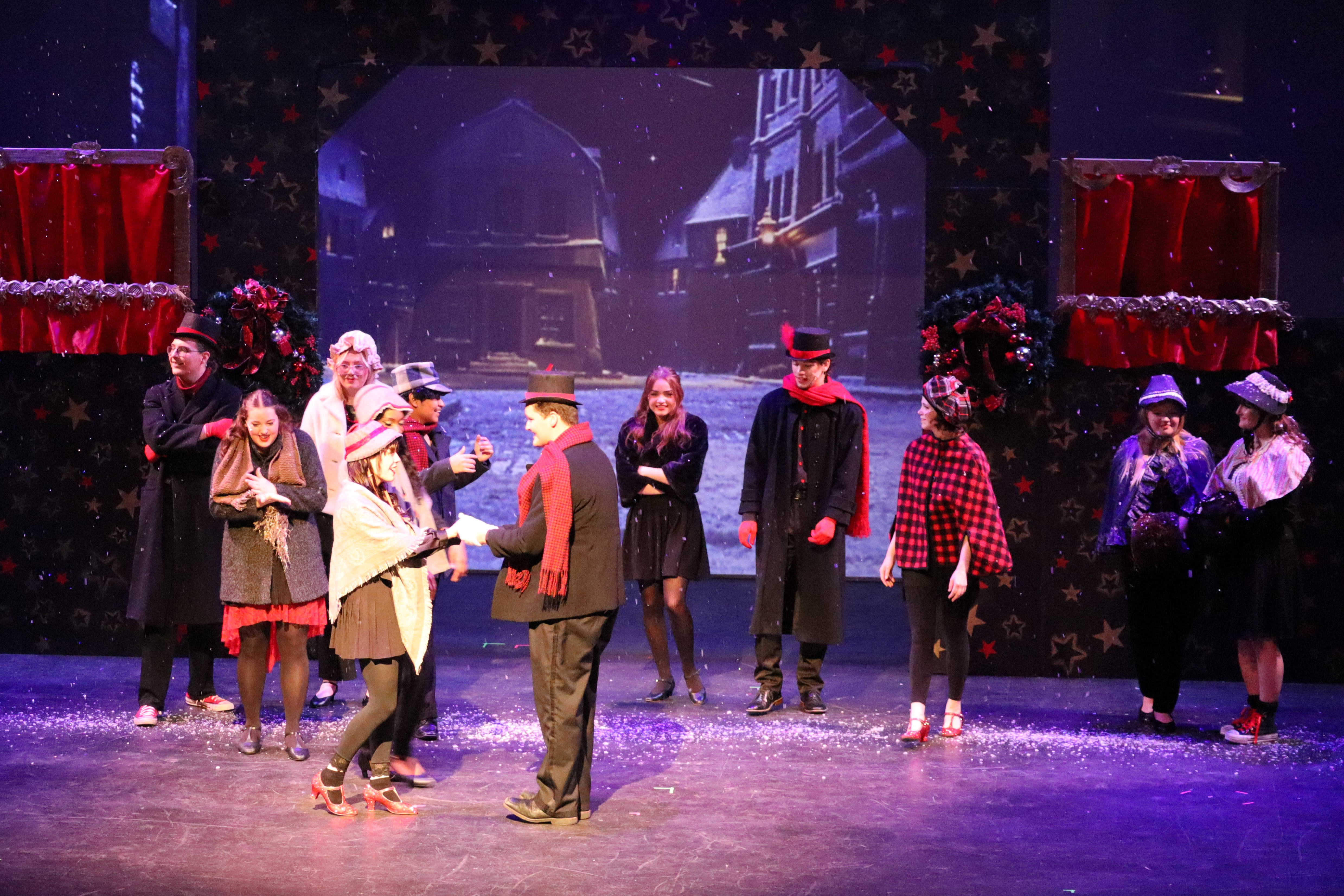 a snow scene on stage with actors