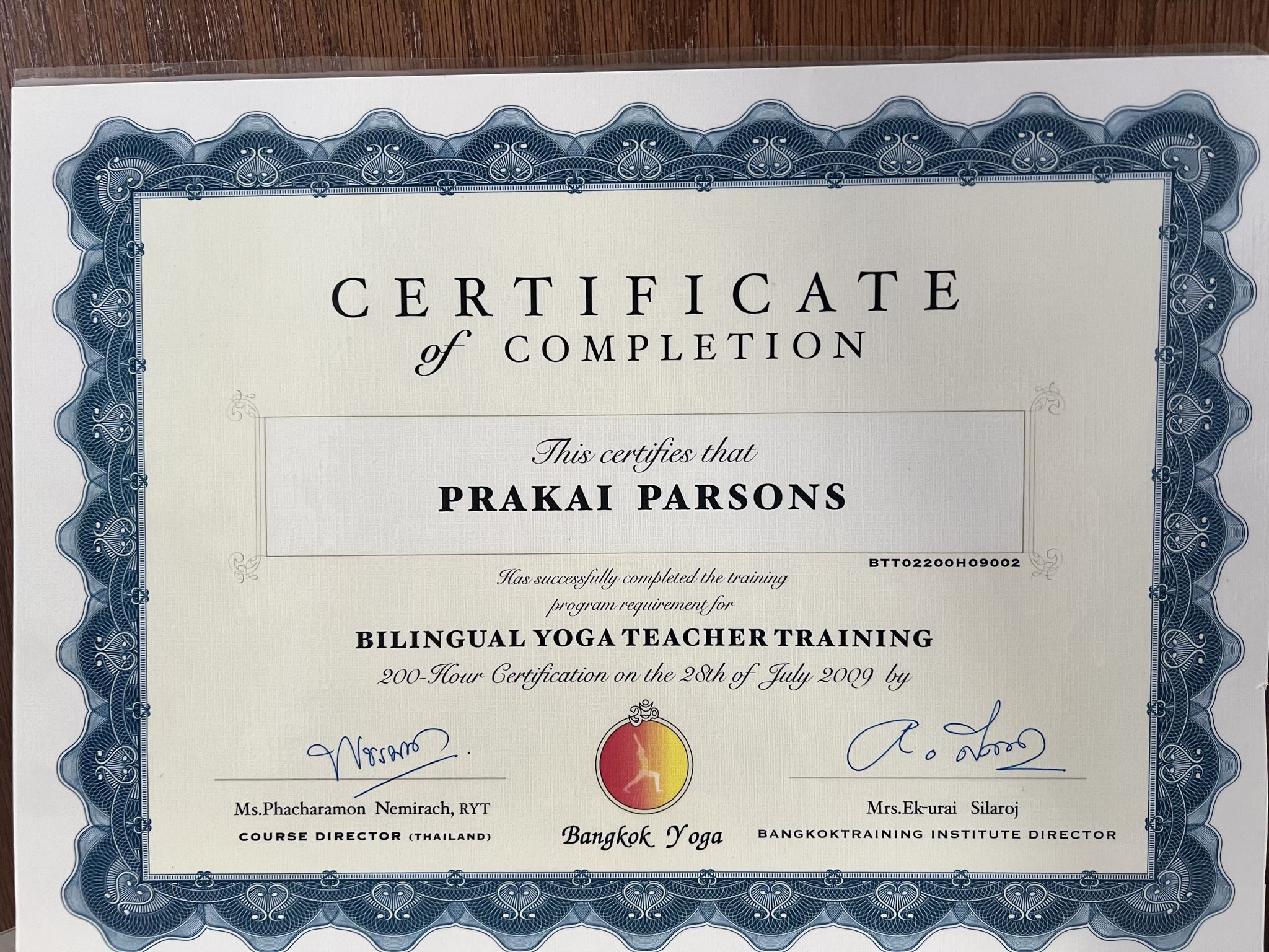 A picture of a certificate of yoga in Thailand. 
